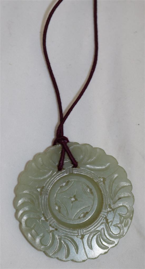 A group of five jadeite pendants and other hardstone carvings, 20th century, 2.4 to 7.7.cm (10)